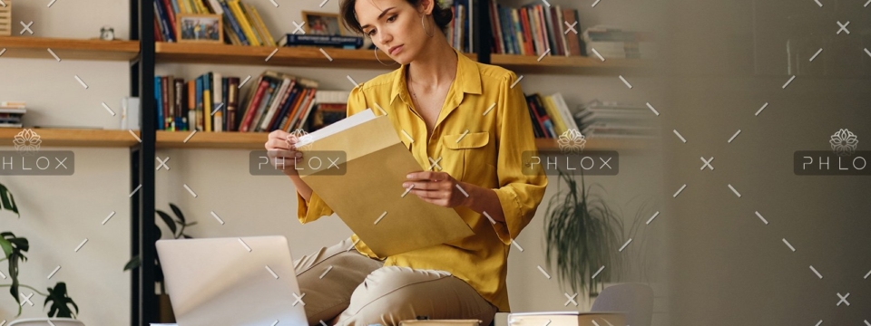 demo-attachment-468-beautiful-woman-in-shirt-sitting-on-desk-with-LE96BAG